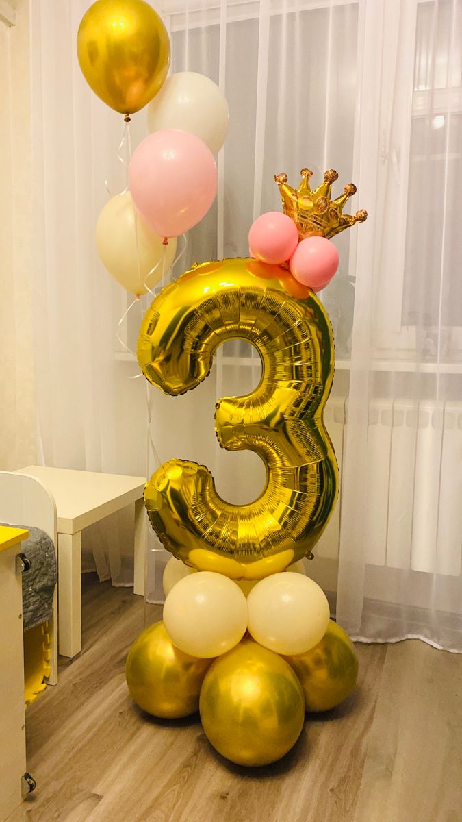 Pastel gold number base with helium balloon