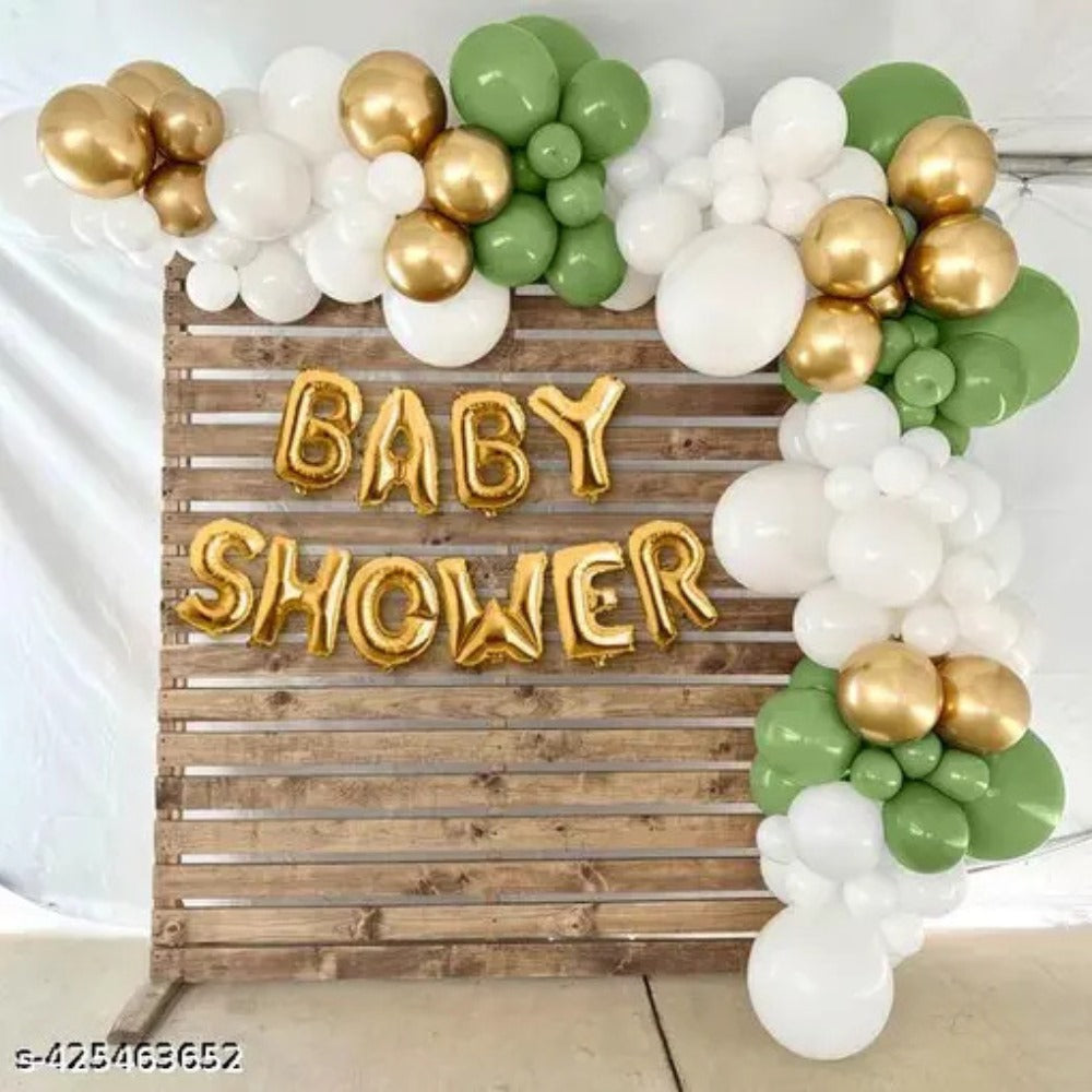 Sage green, white and gold balloon garland with baby shower text
