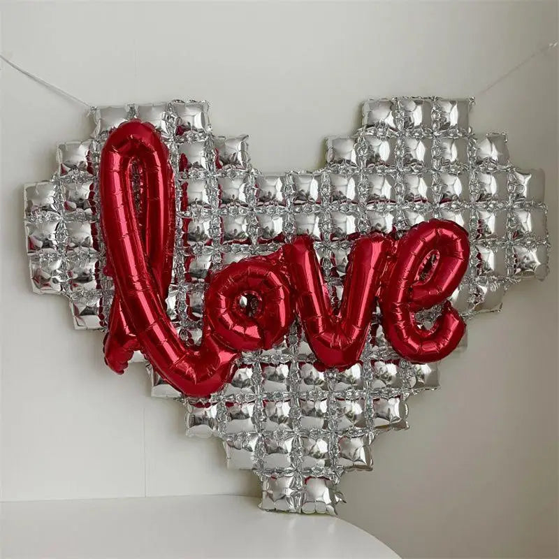 silver heart with red text