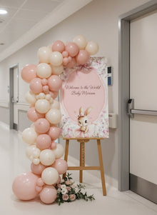 personalized welcome board with artificial flowers